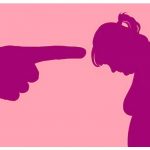 Giant shaming pointing finger pointed at silhouette of a woman with her head bowed